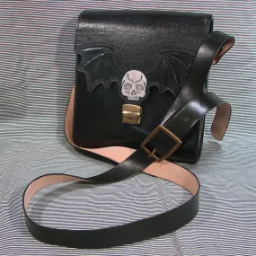 Gothic messenger bag in vegetable tanned leather with skull and bat wings